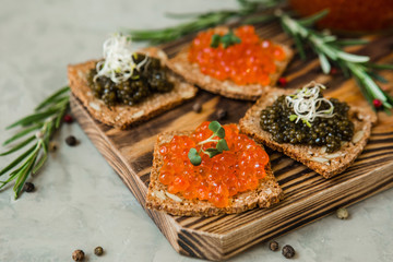 chic expensive red caviar, pike caviar and black caviar for a snack