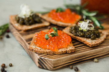 chic expensive red caviar, pike caviar and black caviar for a snack