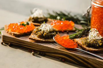 chic expensive red caviar, pike caviar and black caviar for a snack