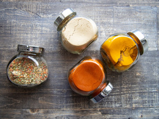 Bright aromatic spices in glass jars