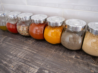 Bright aromatic spices in glass jars