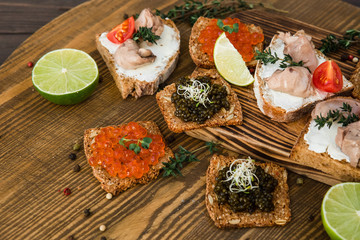 chic expensive red caviar, pike caviar and black caviar for a snack
