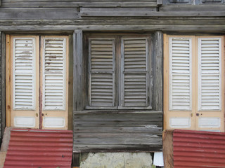 Typical wooden house in Martinique, French West Indies. Tropical wooden windows.