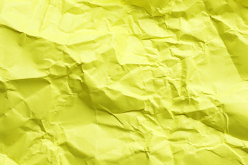 Crumpled yellow paper as background