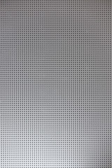 White grill with small round holes