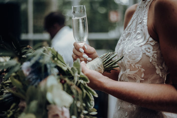 Wedding - Bride with champanger  and bouquet