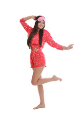 Beautiful woman wearing sleeping mask on white background. Bedtime