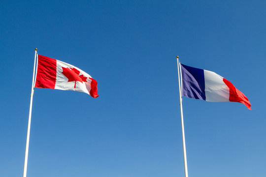 Vimy, France. 2019/9/14. Canadian and French flags flying together at the Canadian National Vimy Memorial (First World War Memorial) on the Vimy Ridge near the town of Arras.