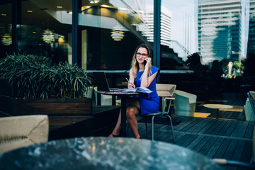 Fototapeta premium Business woman talking to coworker in office space