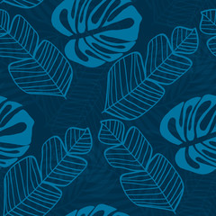 Fototapeta na wymiar Blue tropical leaves pattern. Tropical seamless pattern with white leaves of monstera, banana and palm trees on a blue background.