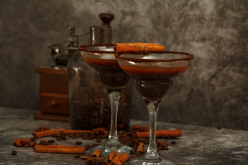 Glasses of cream coffee, cocktail or chocolate martini on a black background.