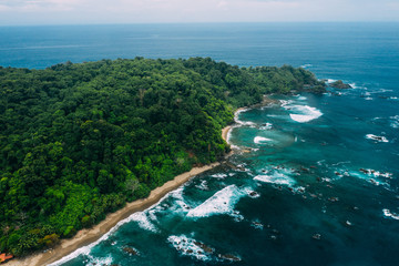 Aerial Drone View of a tropical island with lush jungle in Costa Rica, Isla del Caño