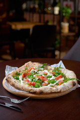 Italian Pizza Restaurant Menu - Pizza with Smoked Salmon and Rocket Salad.