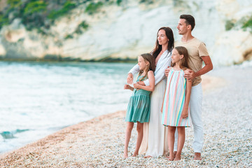 Photo of happy family having fun on the beach. Summer Lifestyle