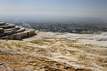 Lookout point over dry hot spring pools of travertine terraces at Pamukkale Turkey