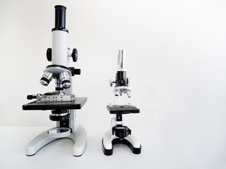 THAILAND - DEC 19, 2019: Asian young man use magnifying glass to zoom Netflix media entertainment online logo on black remote controller meaning about search series or movie for watching