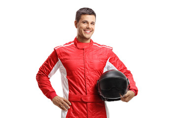 Male racer standing and holding a helmet