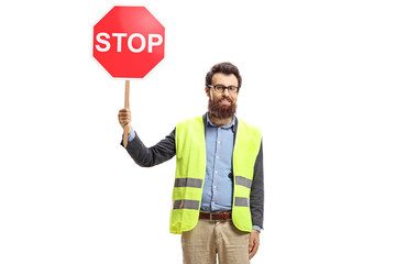 Bearded man with a safety vest holding a stop sign