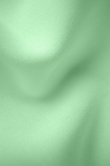 The texture of the fabric closeup, macro photo. Trendy mint color. Spectacular pastel tender background abstract image.