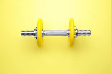 New dumbbell on color background
