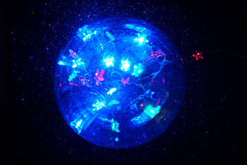 Obraz na płótnie Canvas Magic crystal lights ball with defocused stars. Halloween concept. Christmas concept.
