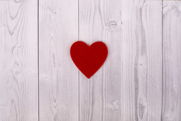 red heart on a grey and white wooden background. valentine's day concept