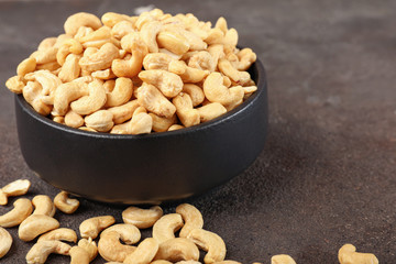 Bowl with cashew nuts on table