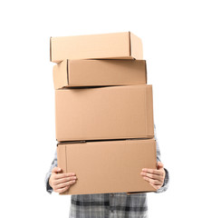 Young woman with moving boxes on white background