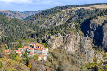 View at Arlempdes village and the Medieval castle ruins in the top of the basaltic column rock, ...