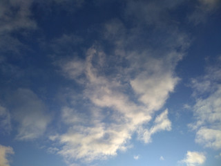 Obraz premium Clouds in sky, sunset, morning light through the blue