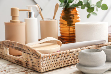 Set of bath accessories on wooden table