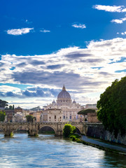 Fototapeta premium A view along the Tiber River towards St. Peter's Basilica in Rome, Italy.