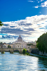 A view along the Tiber River towards St. Peter's Basilica in Rome, Italy.