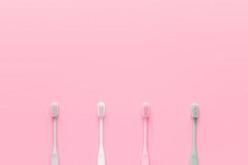 Tooth brushes on color background