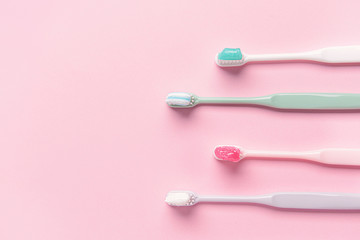 Tooth brushes with paste on color background