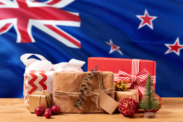 Fototapeta na wymiar New Zealand new year celebration theme. Wrapped christmas gifts on waving national flag background. Merry christmas concept.