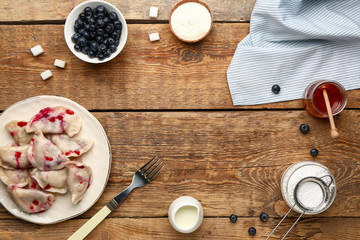 Composition with tasty dumplings and space for text on wooden background