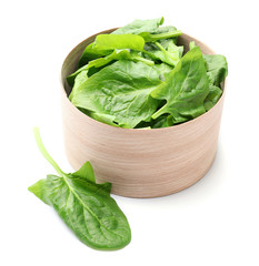 Bowl with fresh spinach on white background
