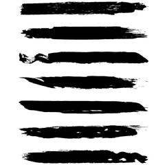A set of grunge brushes. Dry brush strokes on a white background. Abstract black lines. Ink spots