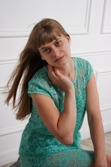 the girl in the mint dress on white background