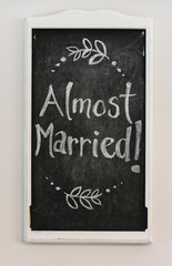 "Almost Married" chalkboard sign