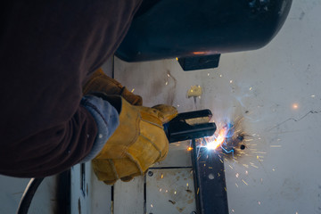 Welder making a support for a panel