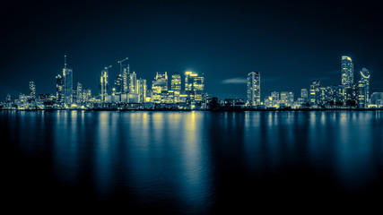 Obraz na płótnie Canvas Night Time Skyline View of Modern Business District Canary Wharf in London