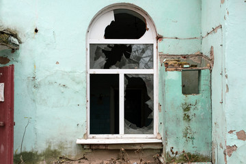 Broken window in an old residential building.
