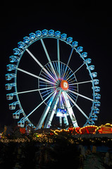 Colorful illuminated big wheel at the Christmas market in Berlin, Germany.