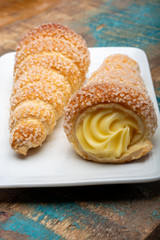 Filled with yellow cream homemade horn pastry