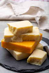 Cheese collection, matured and orange original British cheddar cheese in blocks served with crackers