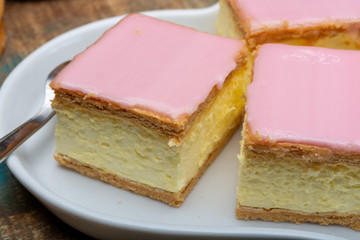 Tompoes or tompouce, iconic pastry in Netherlands and Belgium made from puff dough, icing, cream