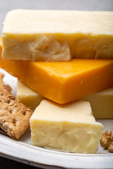 Cheese collection, matured and orange original British cheddar cheese in blocks served with crackers