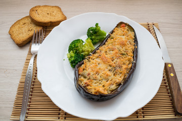 stuffed eggplant accompanied by broccoli and toast